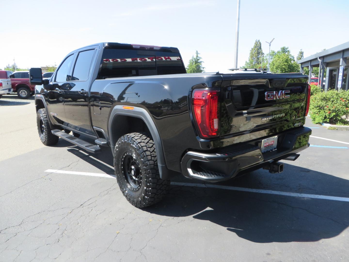 2020 BLACK /BLACK GMC Sierra 2500HD AT4 (1GT49PE76LF) with an 6.6L V8 engine, automatic transmission, located at 2630 Grass Valley Highway, Auburn, CA, 95603, (530) 508-5100, 38.937893, -121.095482 - Features a 3" BDS level kit with Fox shocks, 35" Toyo RT trail tires, 17" Method race wheels, JL audio Subwoofer, Window tint, and a power Tonneau cover. - Photo#6